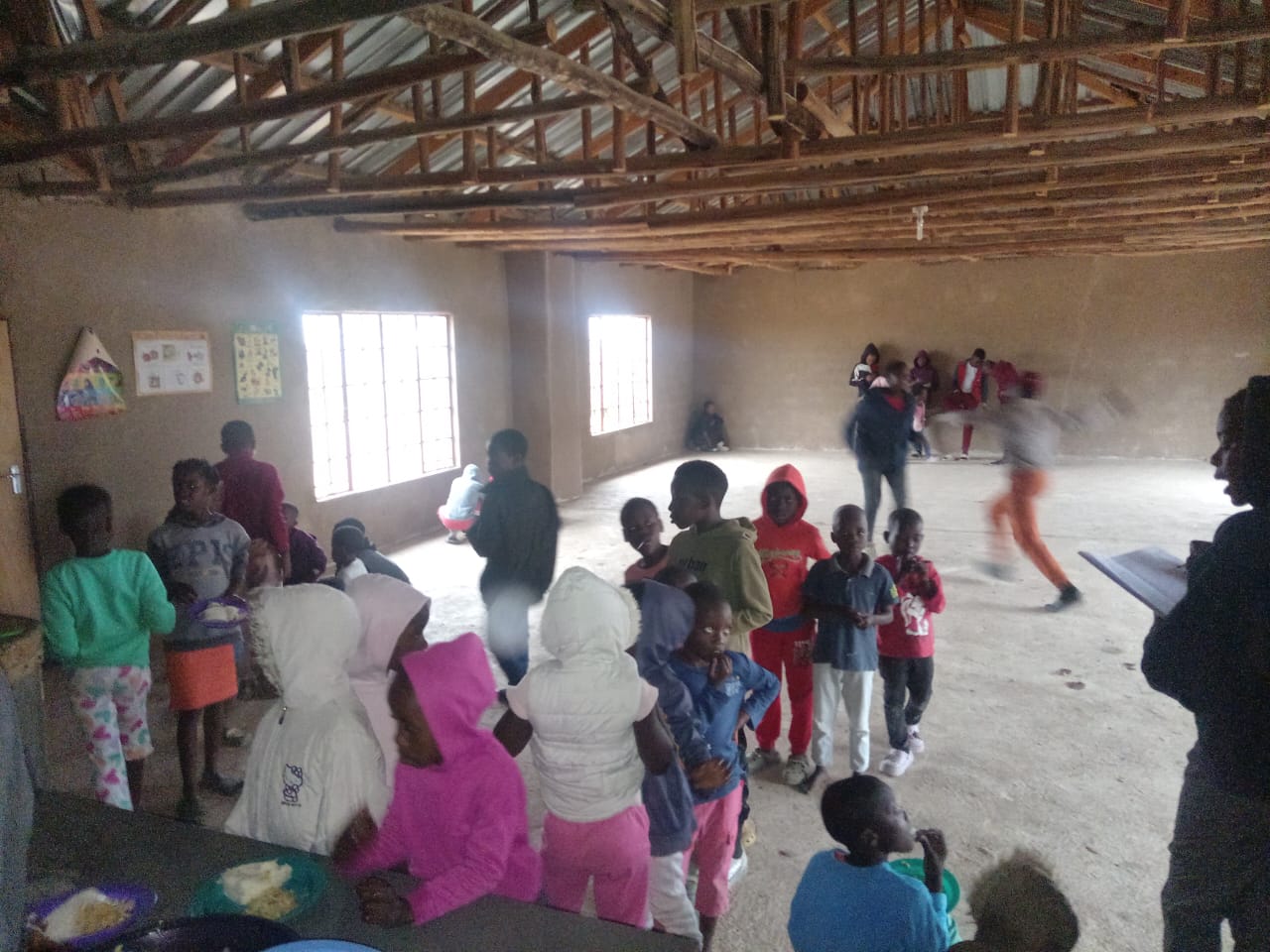 Feeding children at NOMAGOM