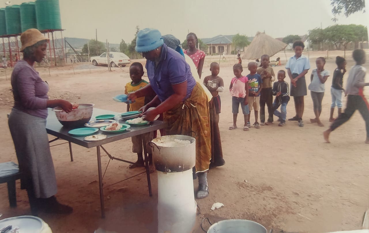 Young children supported by NGO food distribution project