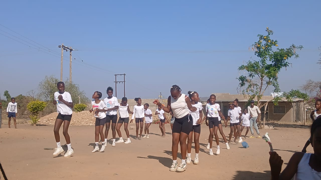 Children performing coordinated dance